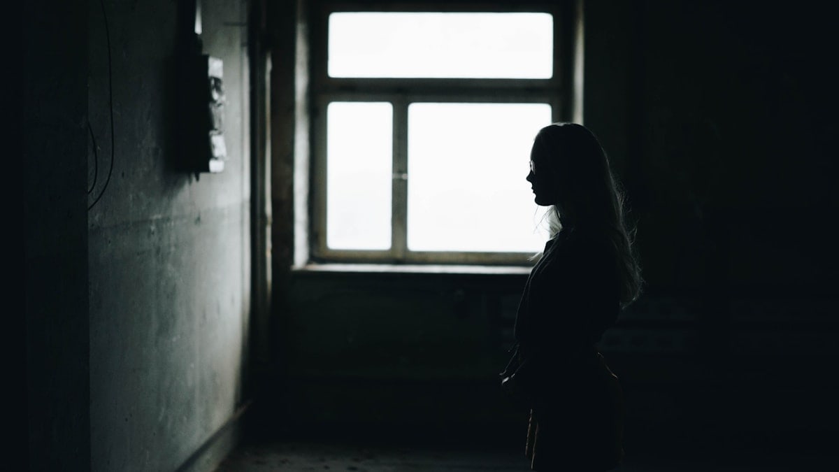 woman in room with window
